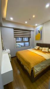 Ліжко або ліжка в номері Saigon South Residence - Vina We Stay