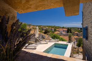 a view of a swimming pool from a house at Villa Zanino in Veliko Grablje