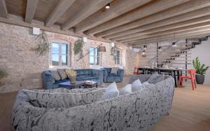 a large living room with couches and a table at Villa Zanino in Veliko Grablje
