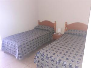 Кровать или кровати в номере Apartamentos Costa Adeje