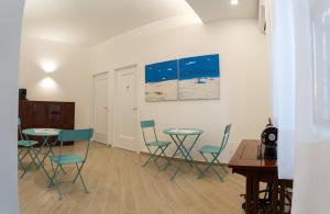 a room with two tables and chairs and a table at Il vicolo di Clara B&B in Diamante