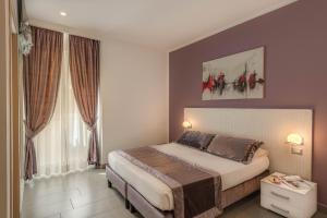 Postel nebo postele na pokoji v ubytování Trevi Palace Hotel