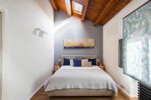 Posteľ alebo postele v izbe v ubytovaní Casa con giardino all'ex Fabbrica di Pomodoro
