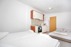 Кровать или кровати в номере Apartman Plaža