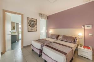 Postel nebo postele na pokoji v ubytování Trevi Palace Hotel