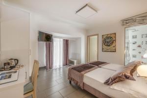 Postel nebo postele na pokoji v ubytování Trevi Palace Hotel