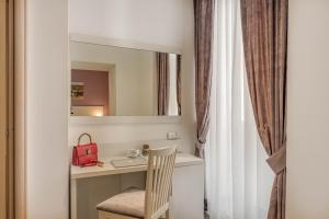 Ванная комната в Trevi Palace Hotel