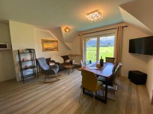 A television and/or entertainment centre at Alpenapartments Steiermark