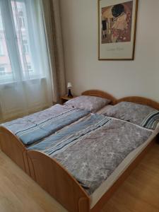 Postel nebo postele na pokoji v ubytování Apartmán Kolonáda