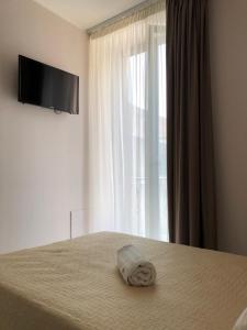 TV a/nebo společenská místnost v ubytování Albergo Milazzo Inn AiMori