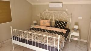 a bedroom with a white bed with pillows at Casa Lira Orșova in Orşova