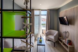 TV a/nebo společenská místnost v ubytování Apartamentos NataLis