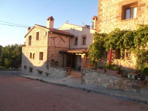 a building on the side of a street at Eras Altas in Selas