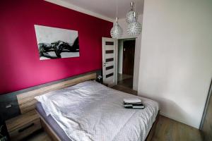 Postel nebo postele na pokoji v ubytování Apartament WHITE