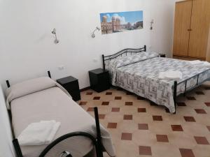 Postel nebo postele na pokoji v ubytování Casa NILLA