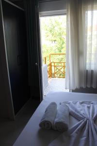 Säng eller sängar i ett rum på Alpat Homes