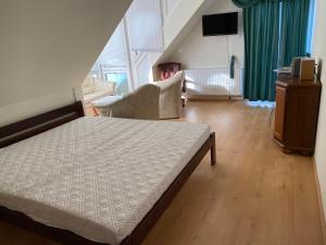 Postel nebo postele na pokoji v ubytování A- Villa (Vendégház)