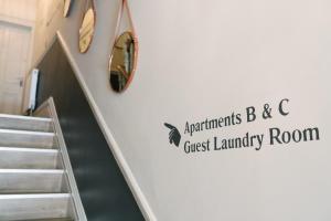 a sign on the wall of a guest laundry room at Bootham Crescent Apartments York in York