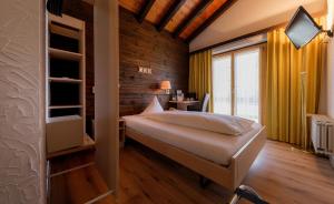 Voodi või voodid majutusasutuse Relais Bayard toas