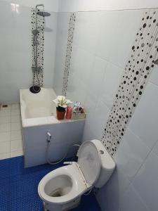 a small bathroom with a toilet and a sink at Stay@Pitaloka in Cirebon