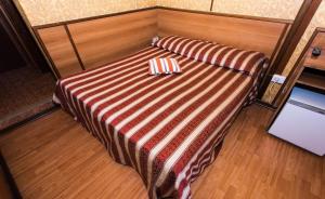 Postel nebo postele na pokoji v ubytování Hotel Artromano