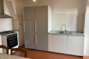 a kitchen with a refrigerator and a sink at LA FINESTRA SUL GOLFO - CITRA 010018-LT-0033 - in Cogorno