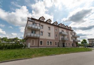 a large building with balconies on the side of it at Apartmán U Berty Třeboň in Třeboň