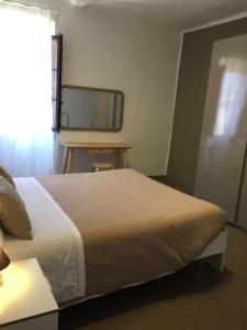 Un pat sau paturi într-o cameră la La Cupola Room