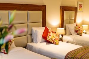 Rúm í herbergi á Grand Hotel Tralee