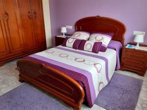 Un pat sau paturi într-o cameră la O Recuncho de Macías