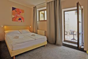 Postel nebo postele na pokoji v ubytování Hotel Pilgrim
