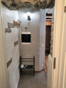 a room with a stone wall with a bed in it at Like Home Apartments Salme 31 in Tallinn