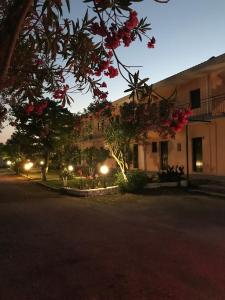 A garden outside Banos Apartments and swimming pool