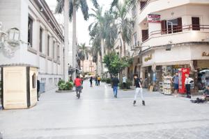 a group of people walking down a street at Cairo City in Cairo