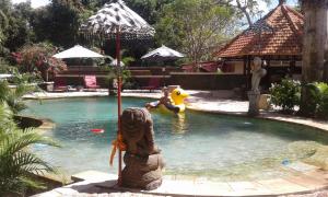 a small swimming pool with a toy in the water at Rasasvada cottages in Uluwatu