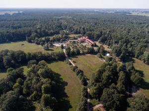 an aerial view of a house in a field at Waldhotel Eiche in Burg +137 photos