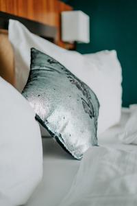 Postel nebo postele na pokoji v ubytování Boutique Hotel Rothenburger Hof