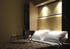 Cama o camas de una habitación en Hotel Alverì