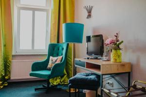 TV a/nebo společenská místnost v ubytování Boutique Hotel Rothenburger Hof