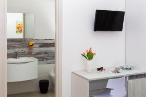 TV a/nebo společenská místnost v ubytování Paloma B&B