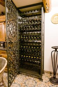 a wine cellar with a wall of wine bottles at Casa MB in Ghioroc