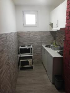 Kuchyň nebo kuchyňský kout v ubytování Apartmani Kuljanin