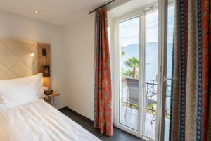 Postelja oz. postelje v sobi nastanitve Hotel Collinetta