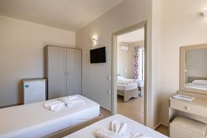 Posteľ alebo postele v izbe v ubytovaní Hotel Kathrin Beach