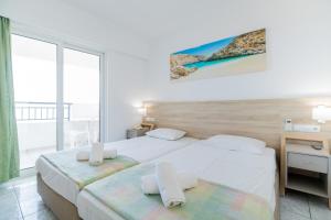 Postel nebo postele na pokoji v ubytování Horizon Beach + 37 fotografií