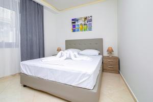 Postel nebo postele na pokoji v ubytování Amara Residences by Estia