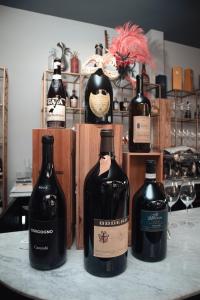 a group of wine bottles sitting on a table at THE PALMS Luxury Boutique Hotel in Dakar