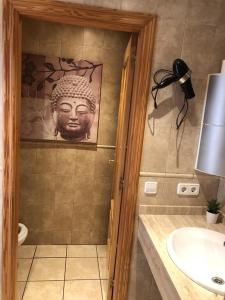 a bathroom with a shower with a head on the wall at La Mundial Formentera in Es Pujols
