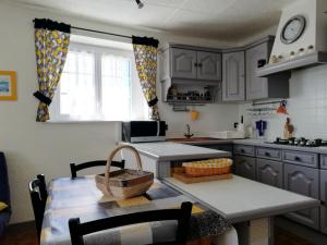 a kitchen with a table and a table sidx sidx sidx at Maison cosy à La Tranche-sur-Mer - 45 m² avec jardin in La Tranche-sur-Mer