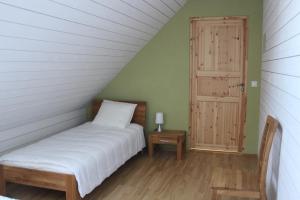 Postel nebo postele na pokoji v ubytování Rootsimaa Holiday House